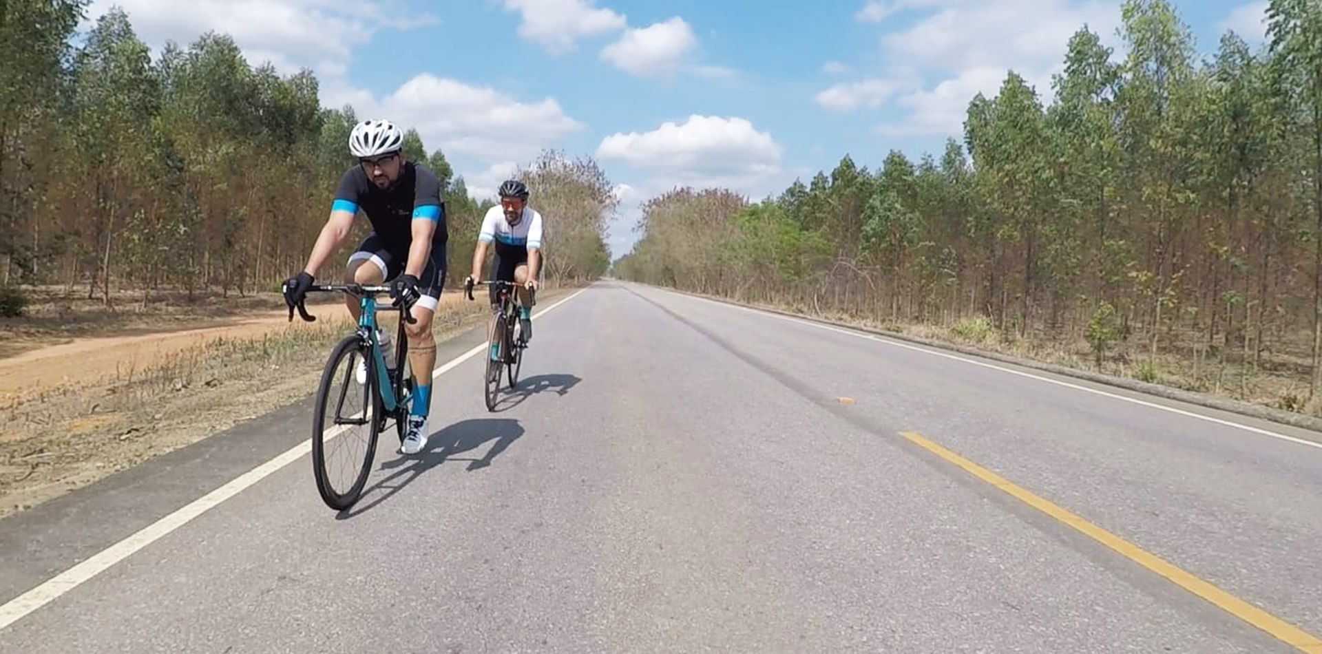 road-bike-race-two-cyclists-riding-lightweight-stiff-wheels